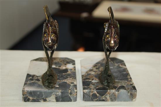 A pair of French Art Deco painted bronze bookends, modelled as fish amongst reeds, 5.5in.